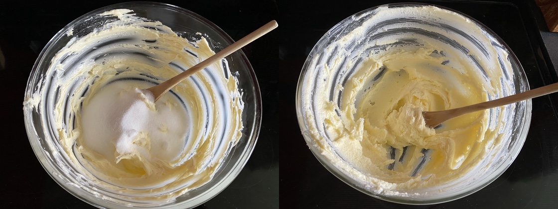White sugar combined with butter in a large glass mixing bowl.